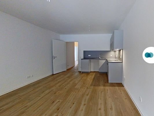 Ansicht II: Wohn- und Esszimmer mit offenem Küchenbereich