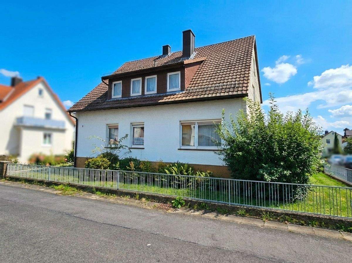 Immobilie in Ahnatal - Gepflegtes Zweifamilienhaus in Ahnatal-Weimar - Bild 1