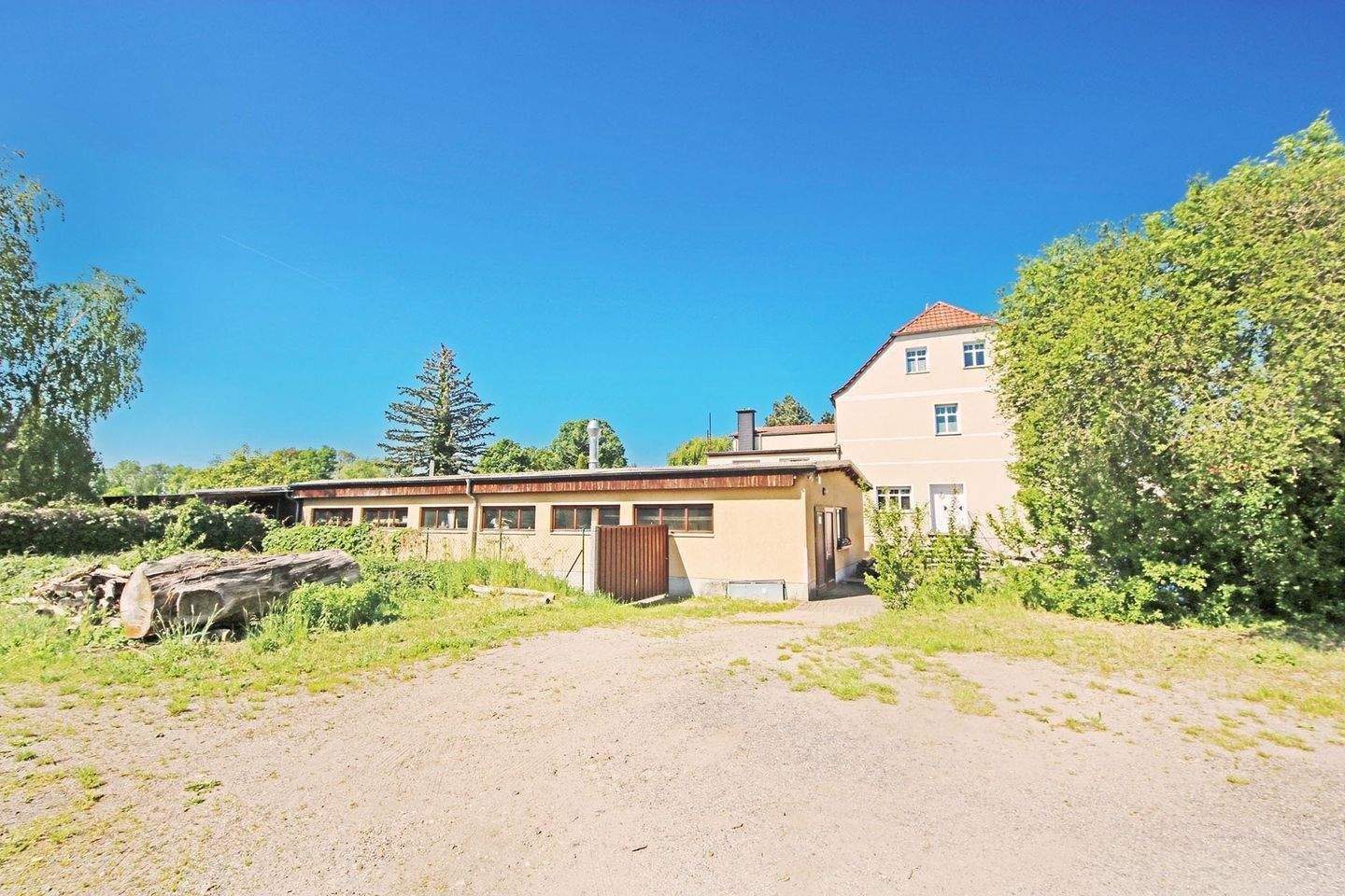 Immobilie in Jessen (Elster) - Mehrfamilienhaus mit 3 Wohnungen und großem Werkstattgebäude in Jessen (Elster) OT Holzdorf - Bild 4